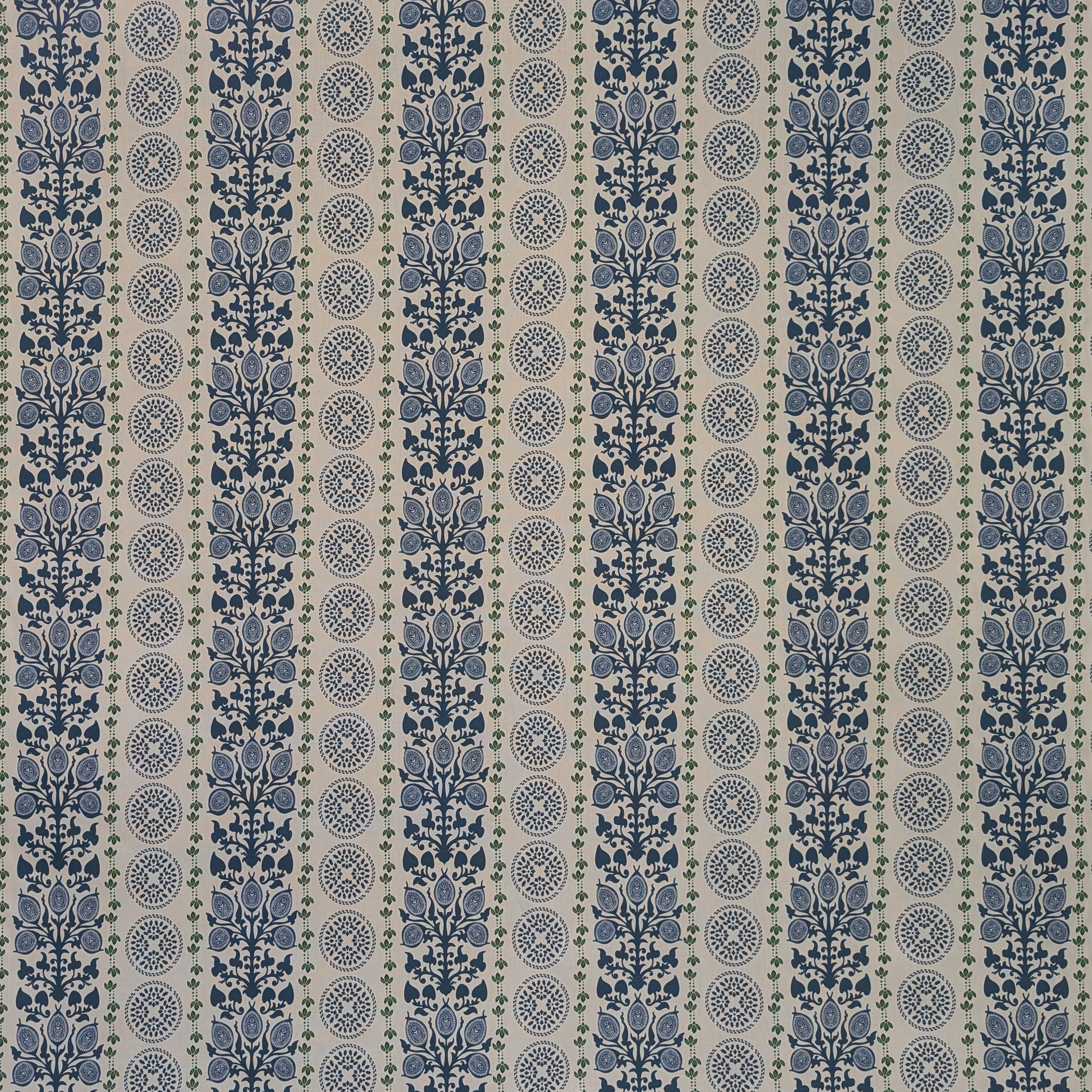 Patterned fabric with blue and beige stripes on a plain background