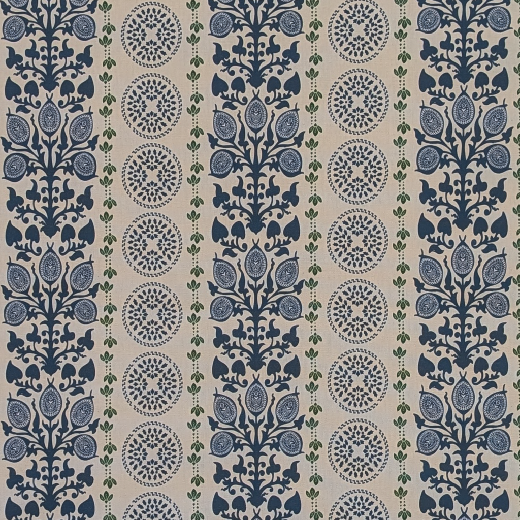 Patterned fabric with blue and green design on a beige background