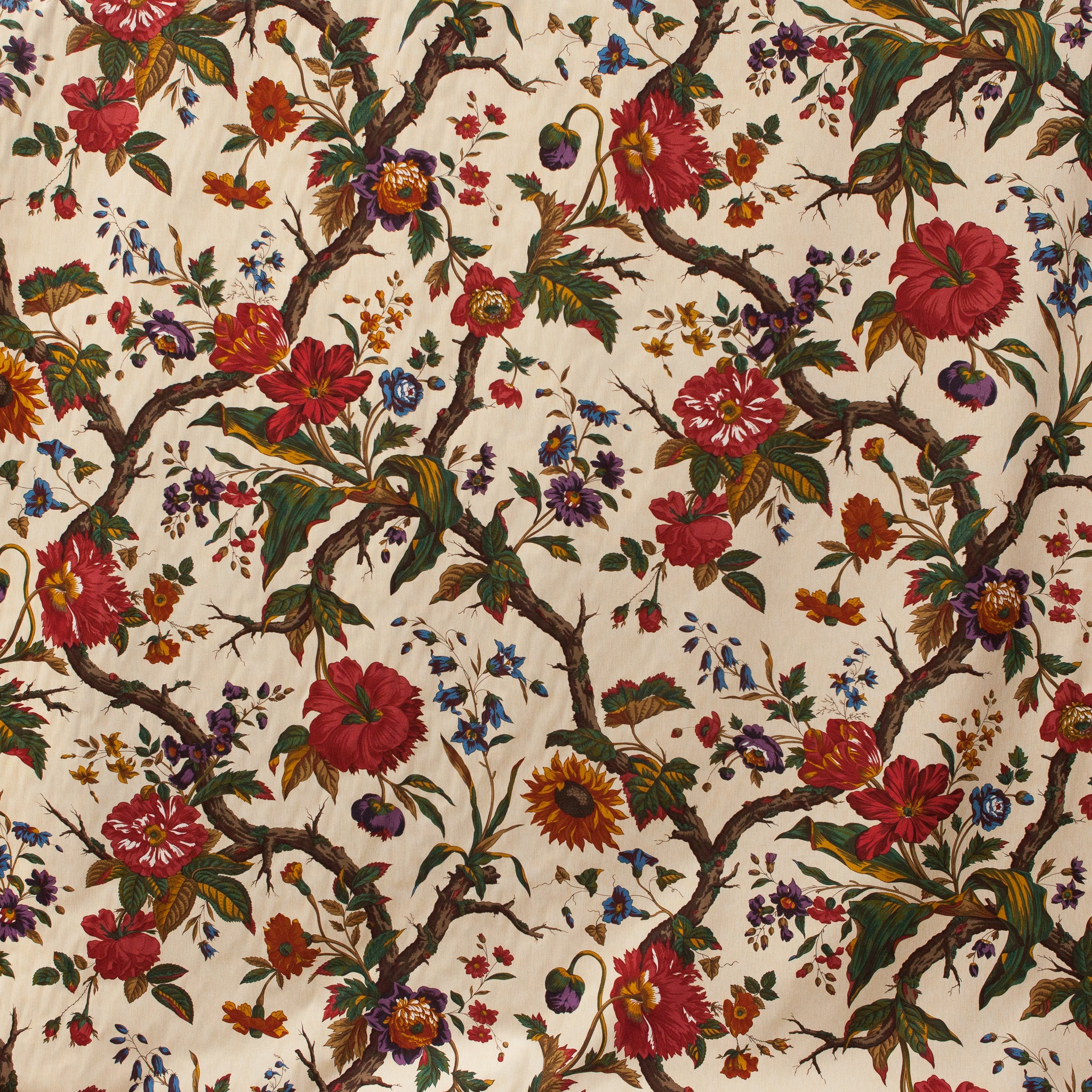 Detailed floral pattern with red and orange flowers on a beige background