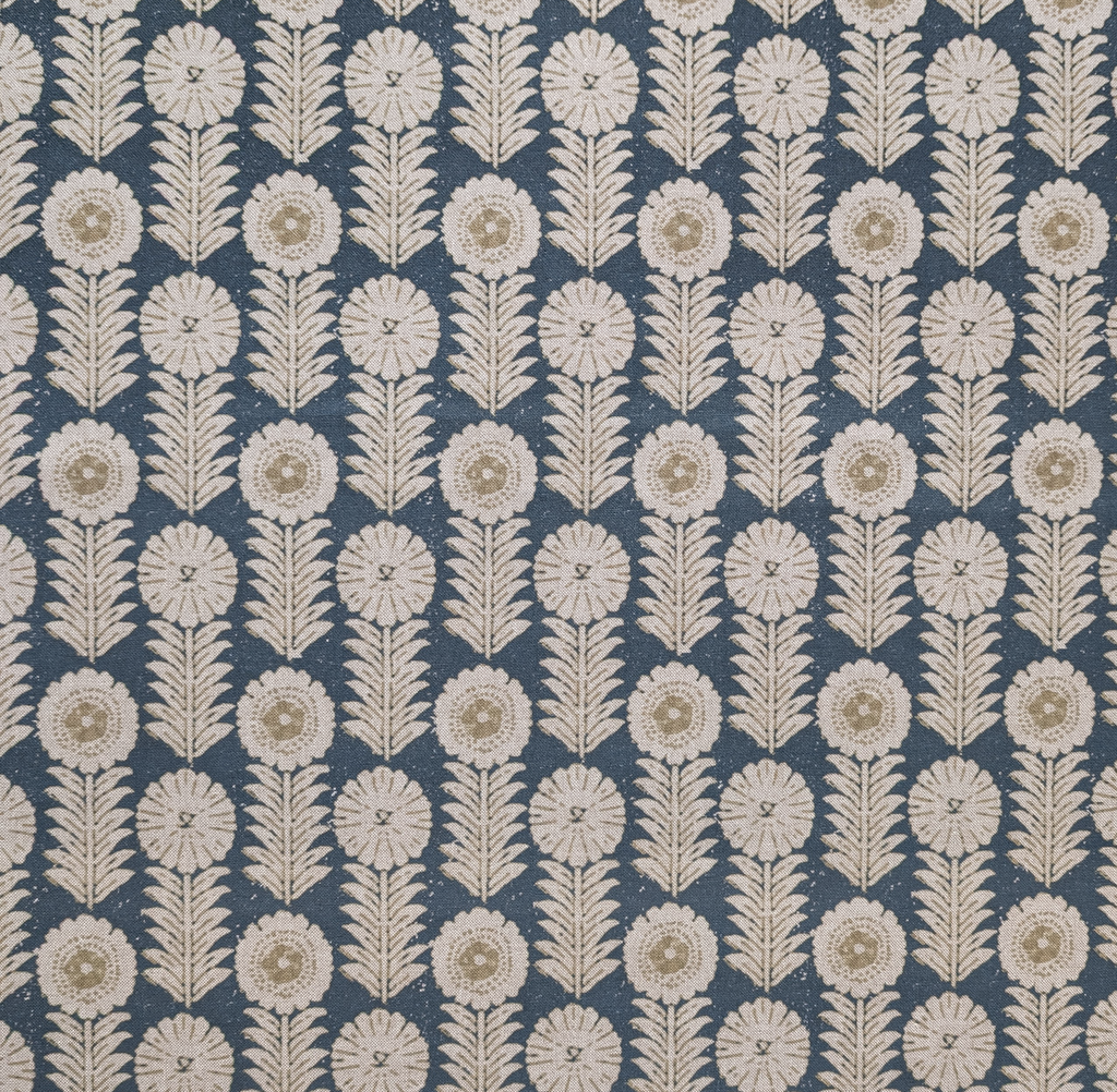 Patterned fabric with white floral design on a blue background