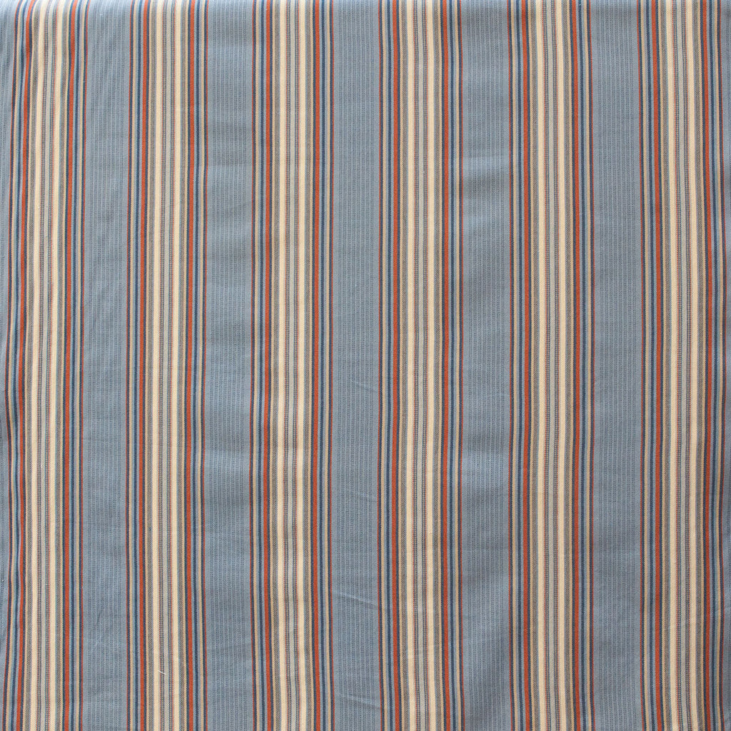 Striped fabric with horizontal lines in various colors on a blue background