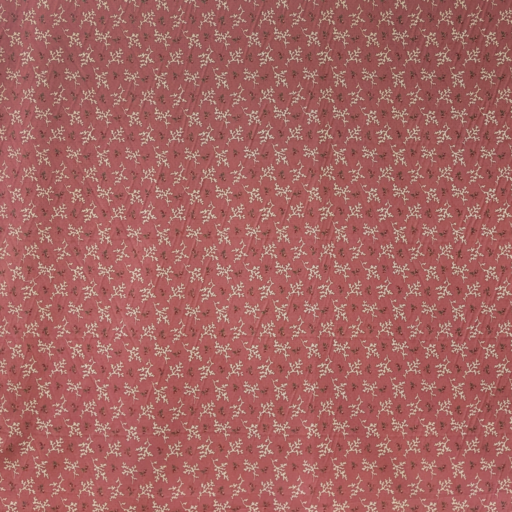 Small floral and coral pattern on a red background