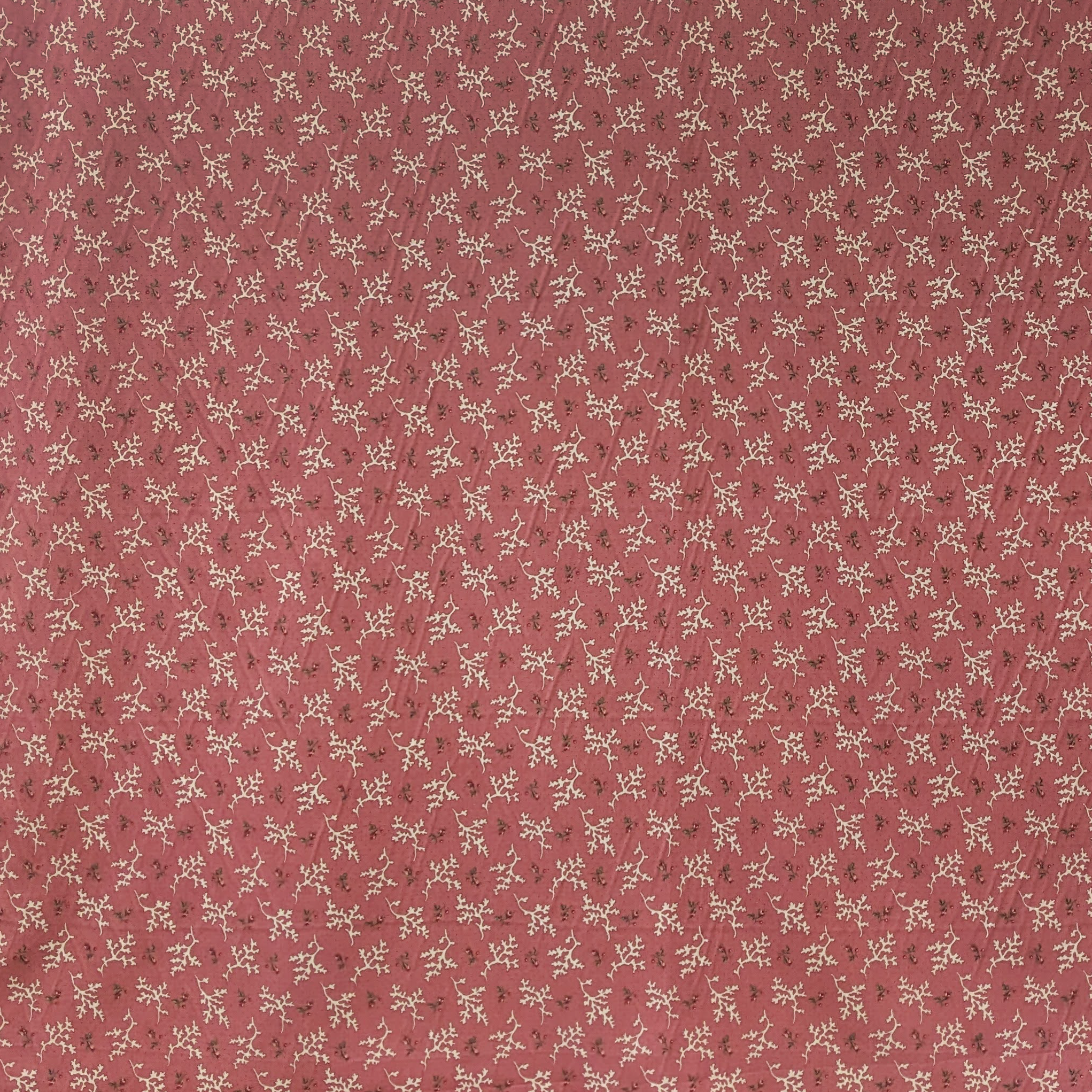 Small floral and coral pattern on a red background