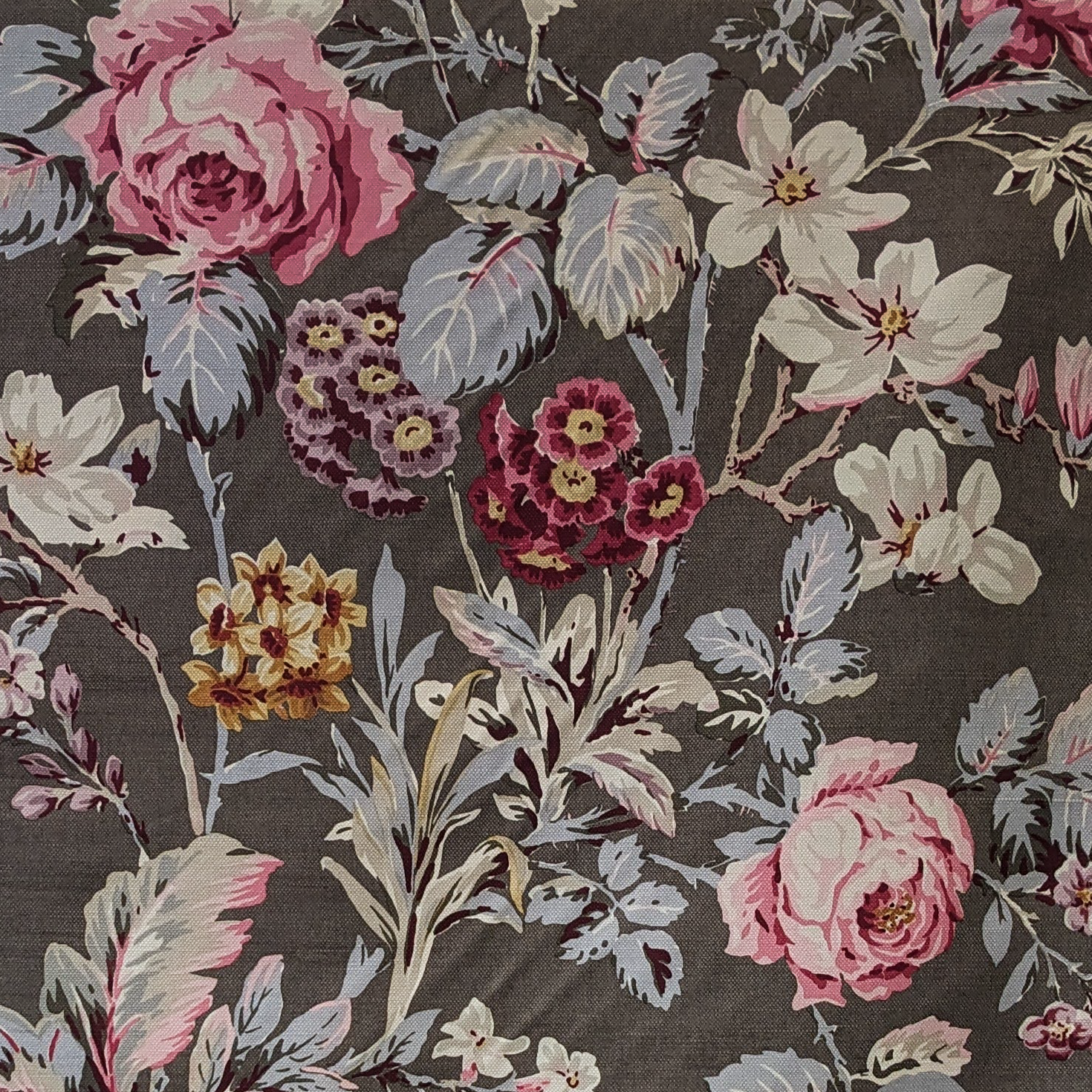 Floral pattern with pink, white, and purple flowers on a dark background
