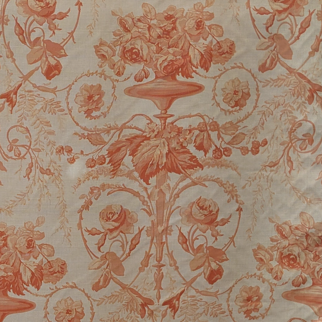 Decorative floral and urn pattern on a beige background