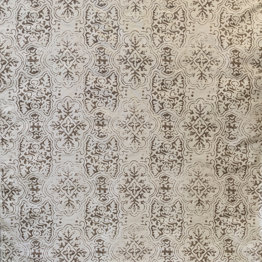 Decorative pattern with intricate designs on a beige silk background