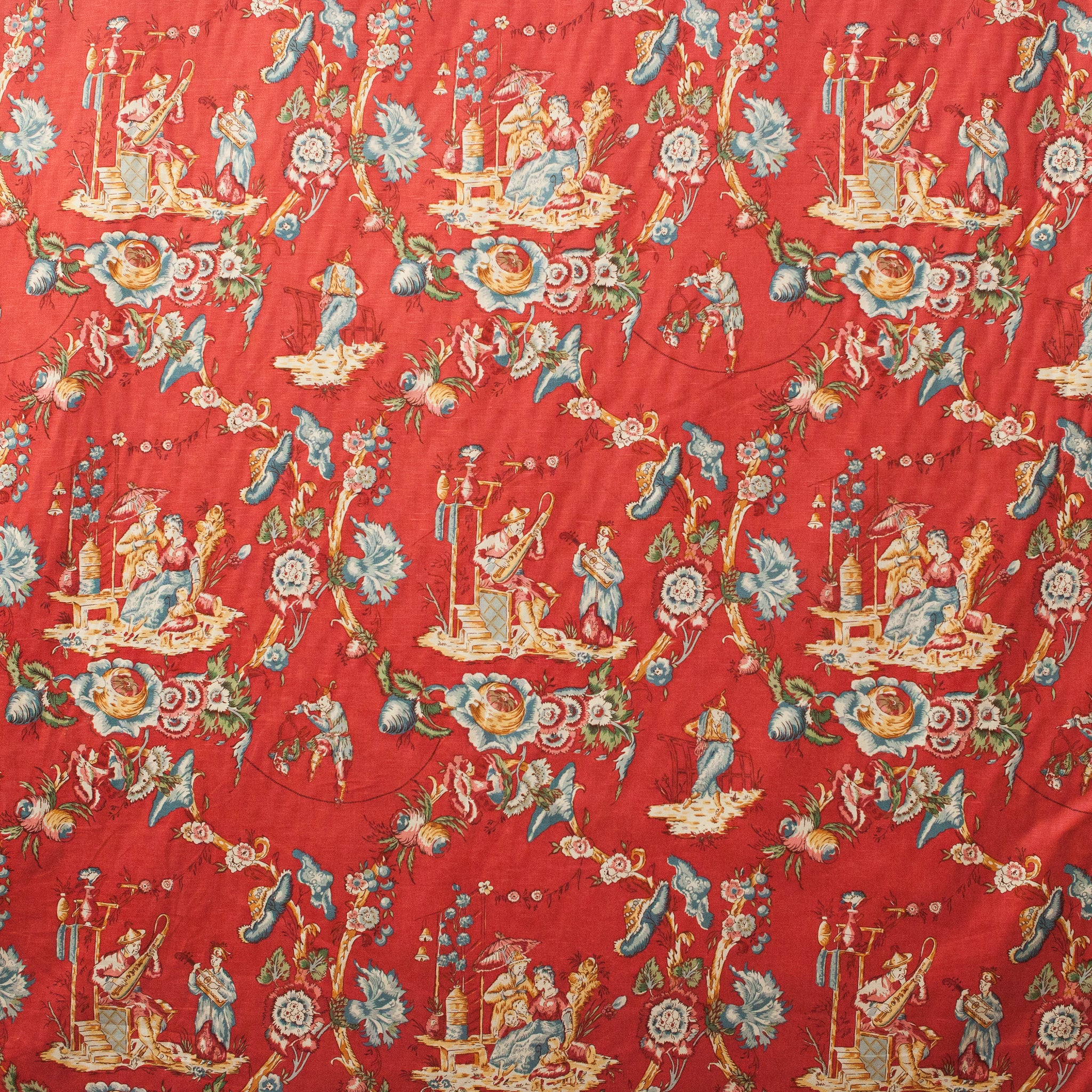 Red and blue toile design with flowers and people 