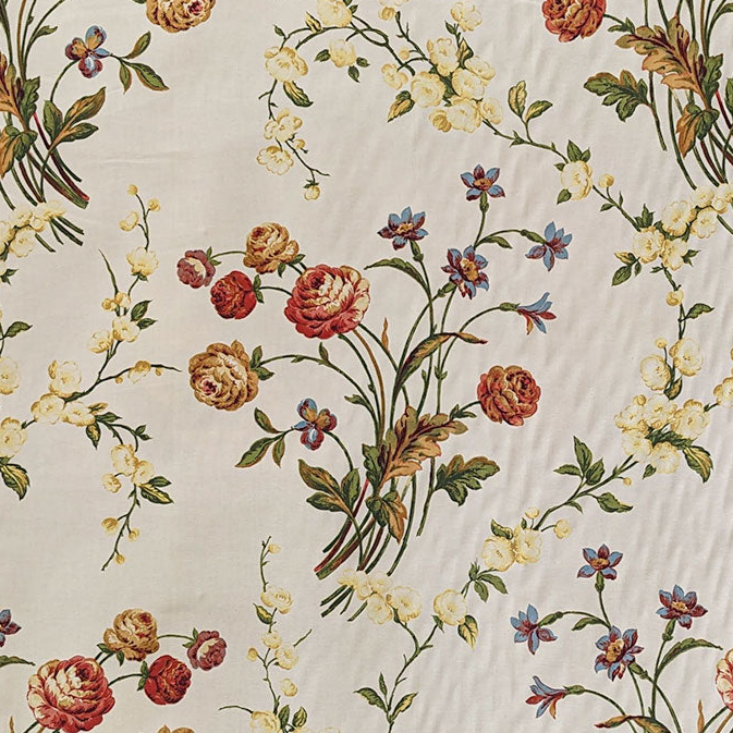 Floral patterned fabric with colorful flowers on a beige background