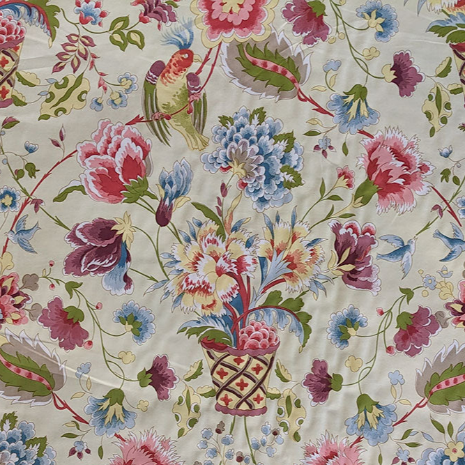 Bird and flowers in baskets with purple, blue and pink with a cream background