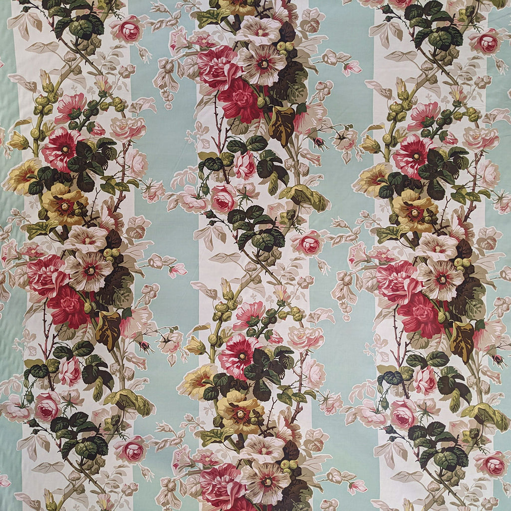 Floral pattern with pink, red, and yellow flowers on a light blue and white striped background
