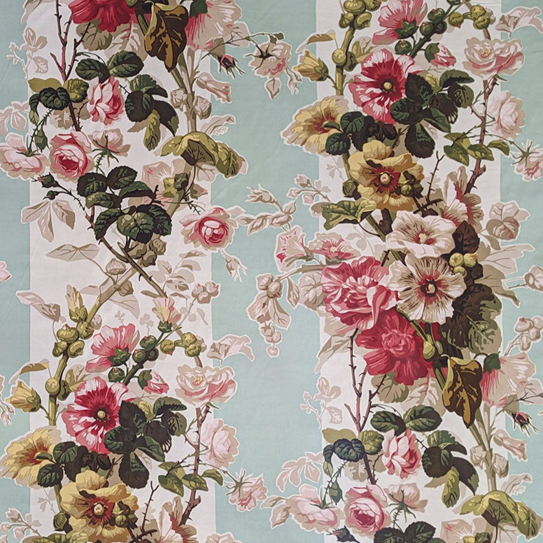 Floral pattern with pink, red, and yellow flowers on a light blue background