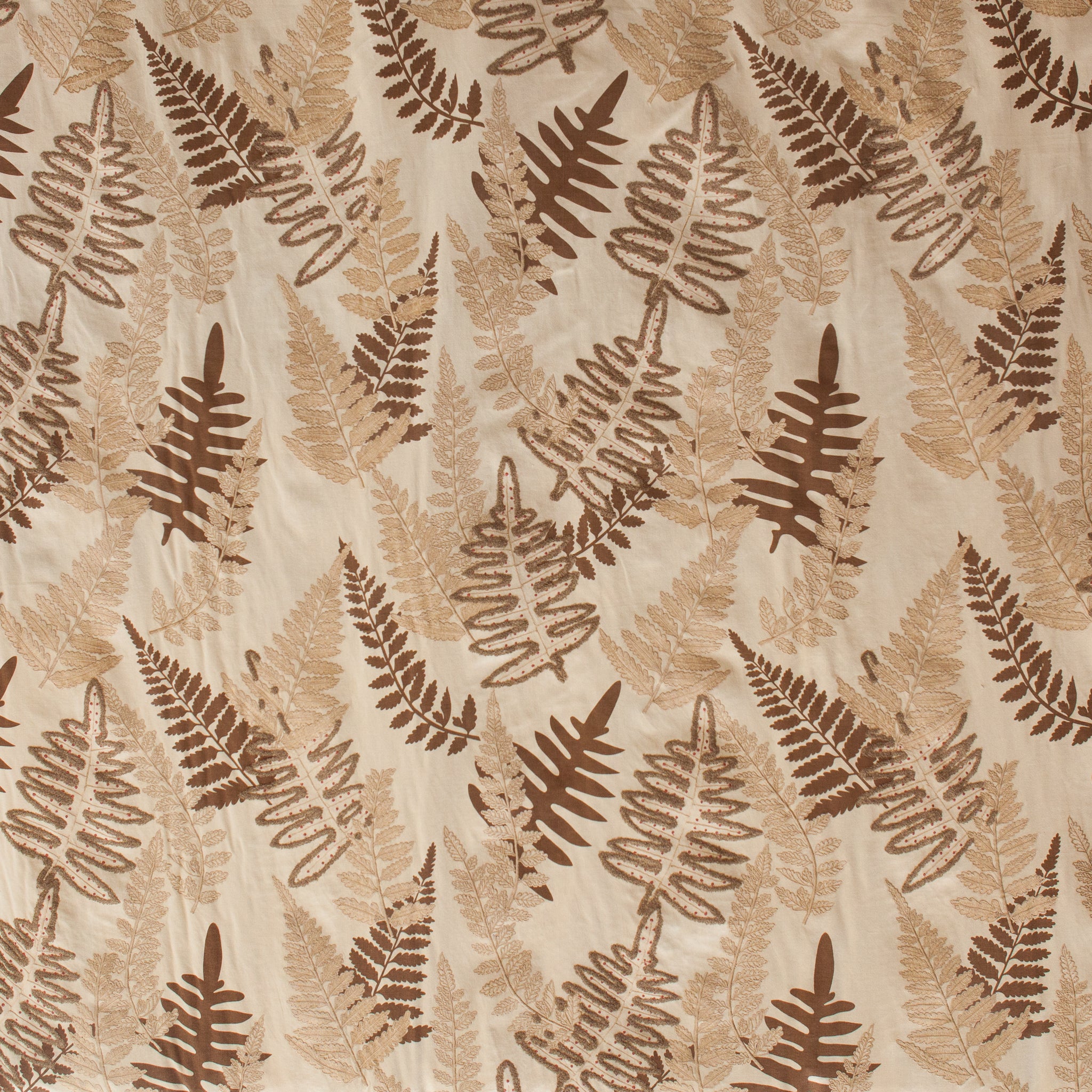 Pattern of brown fern leaves on a beige background