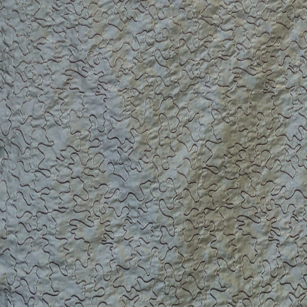 Textured stone wall with wavy pattern