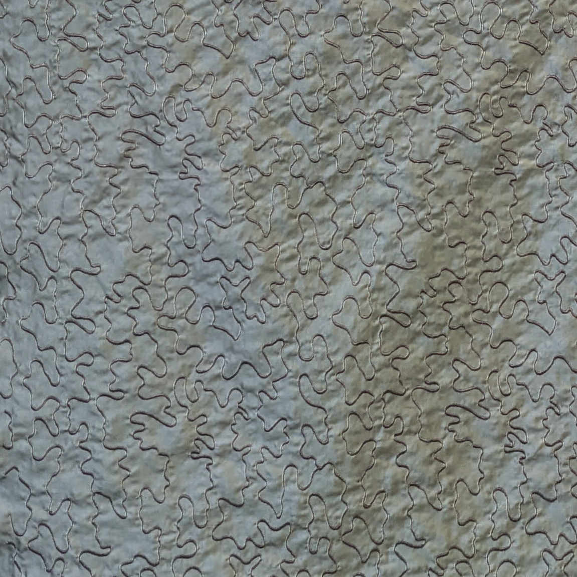 Textured stone wall with wavy pattern