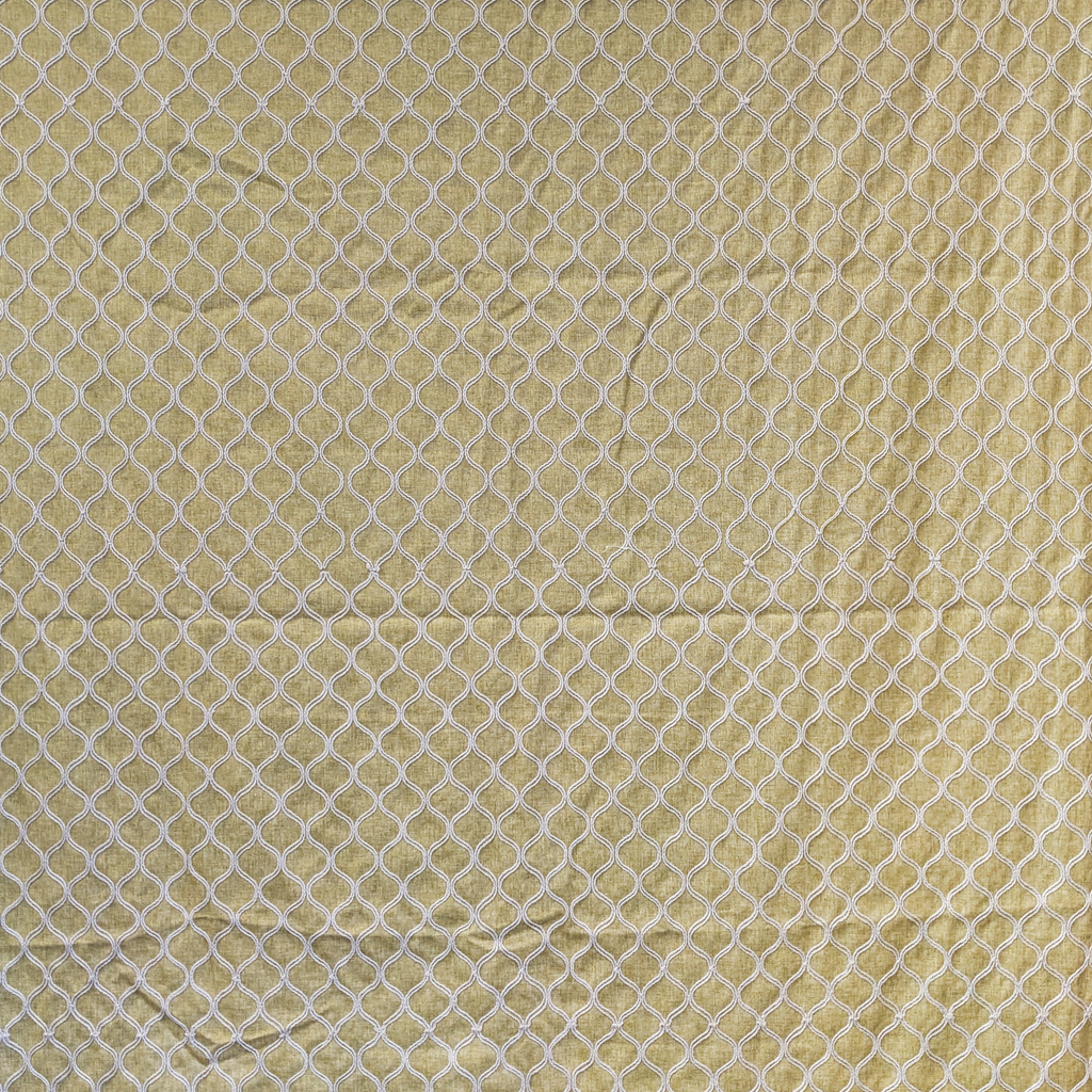 Embroidered trellis fabric in Mustard 