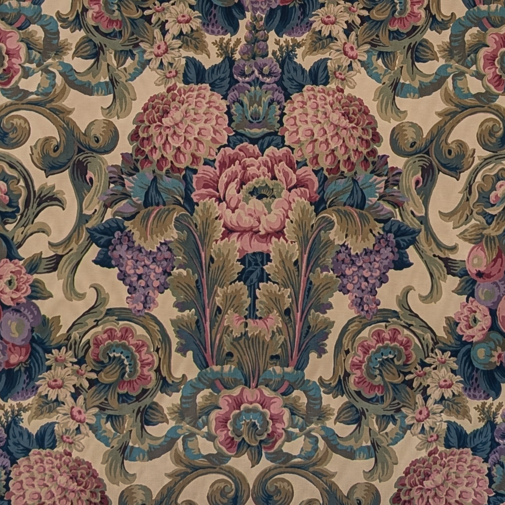 Decorative fabric pattern with flowers and swirls in pink, purple, and green on a beige background.