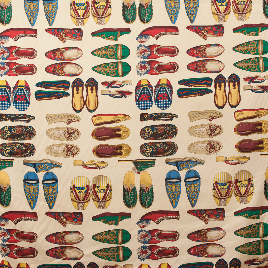 Pattern of colorful oriental shoes on a beige background
