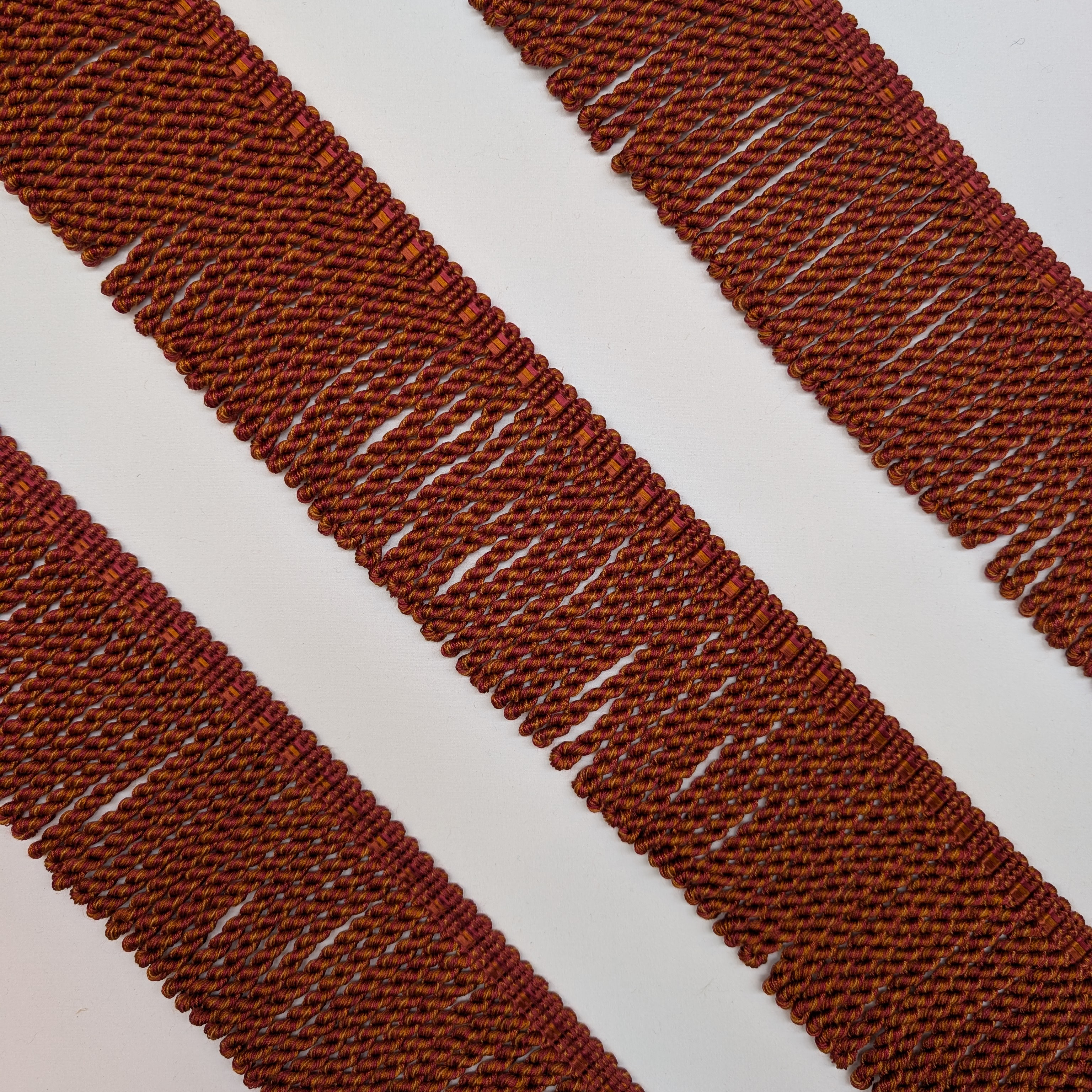 Close-up of red woven fabric with a white background