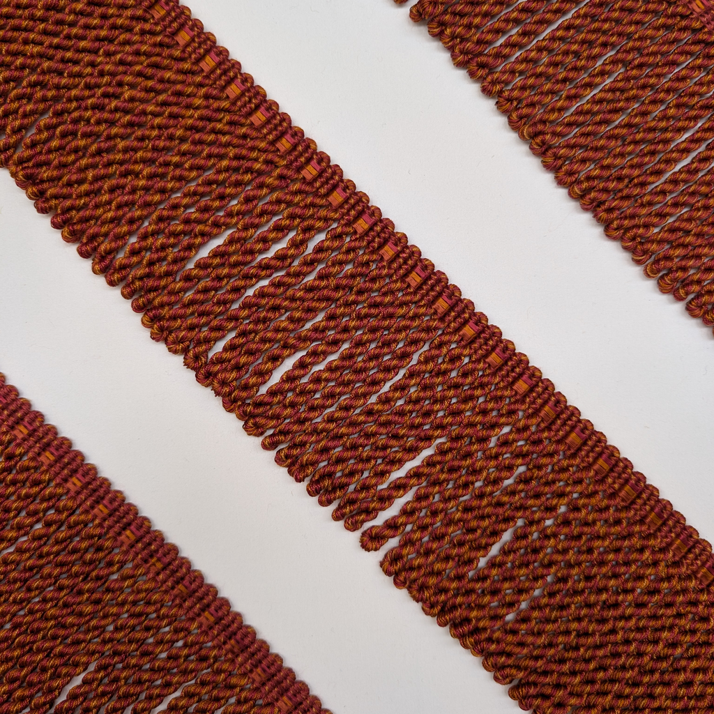 Close-up of red woven pattern on a white background