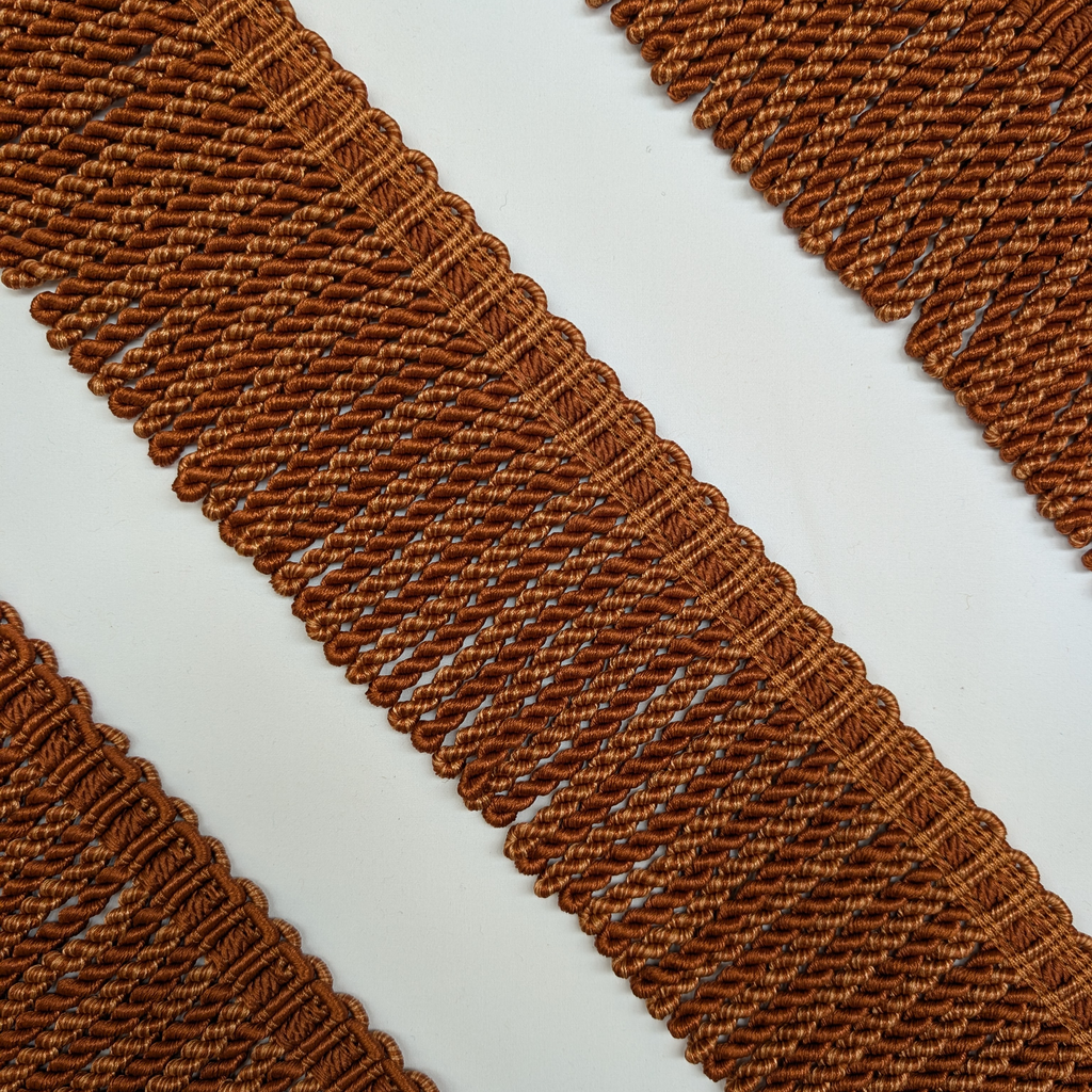 Close-up of brown textured fabric on a white background