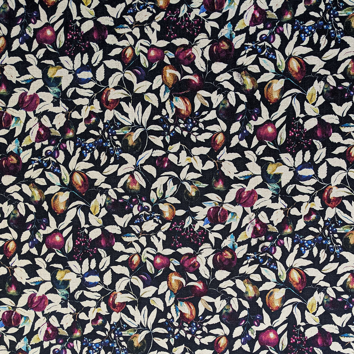 Patterned fabric with fruits and leaves on a black background