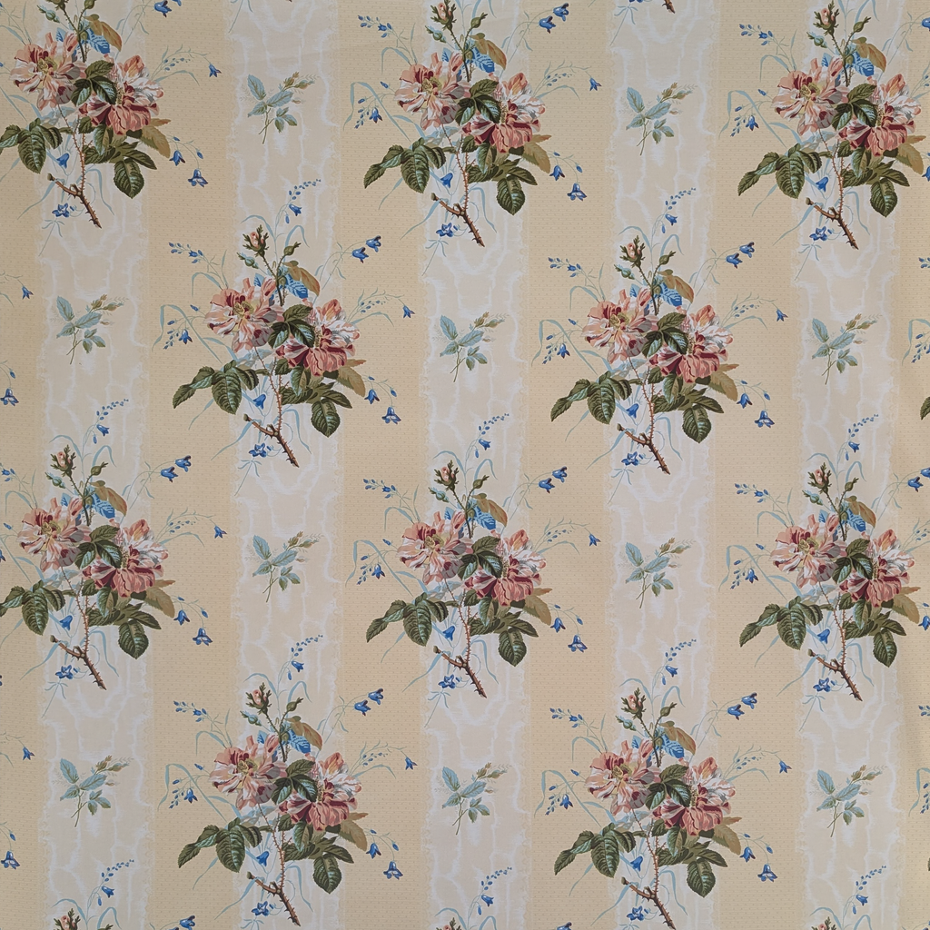 Floral patterned fabric with pink flowers and green leaves on a beige background