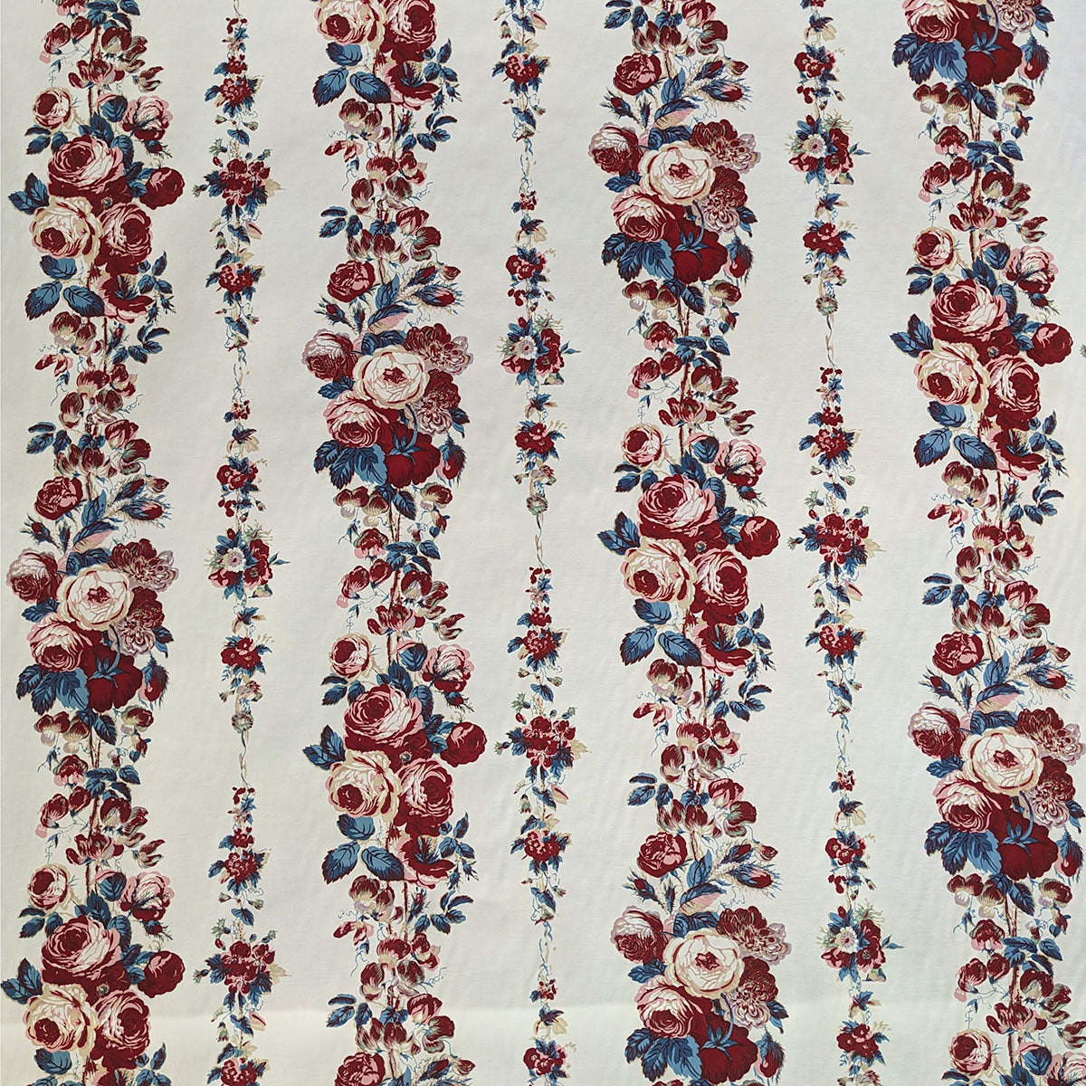 Floral pattern with red, blue, and white flowers on a beige background