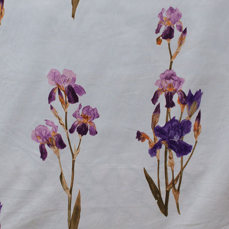 Pattern of purple and pink flowers on a textured white fabric background