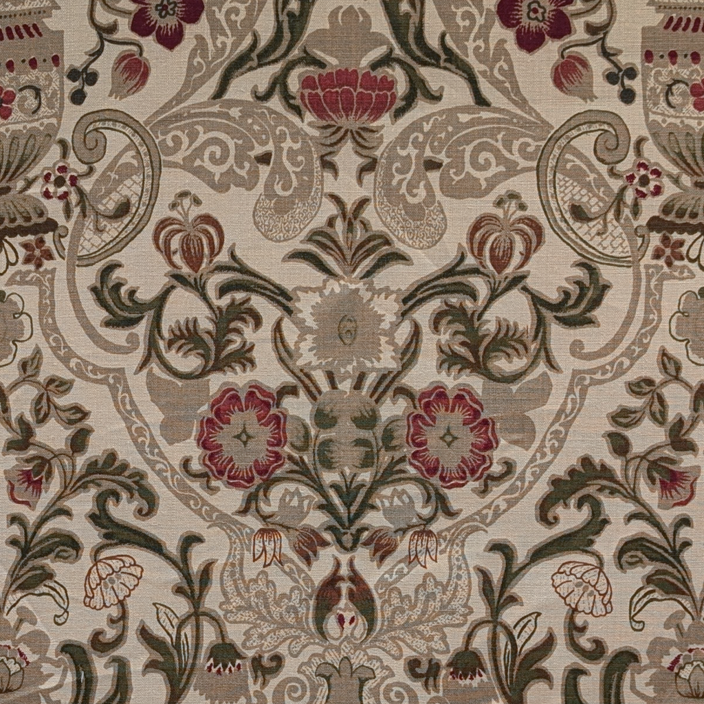 Close-up of a patterned fabric with floral and ornamental design.