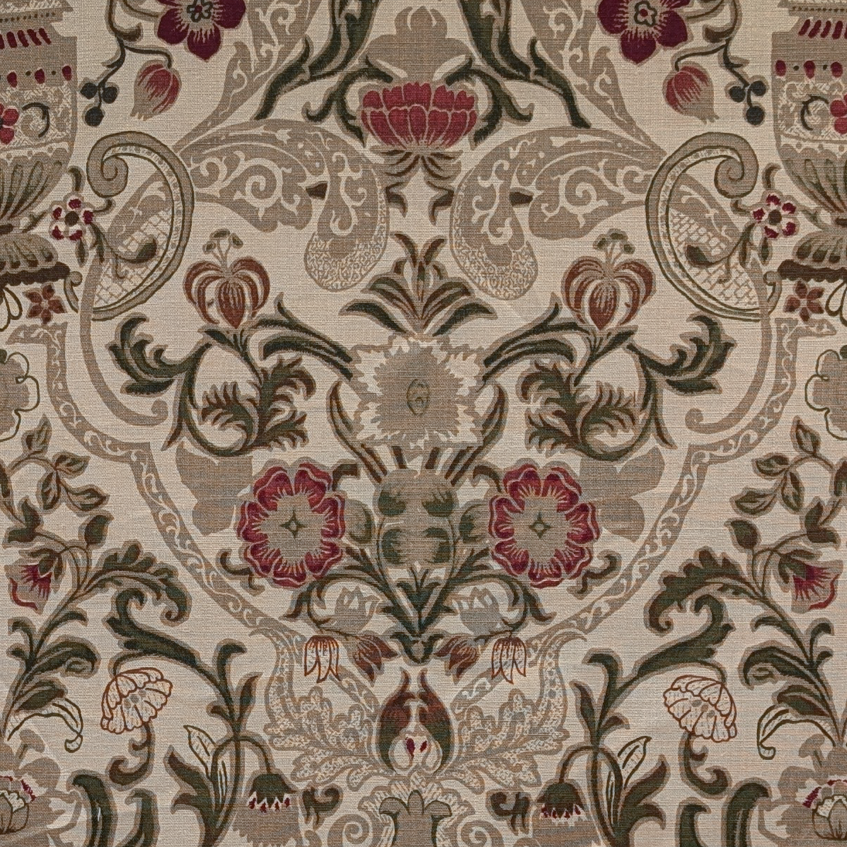 Close-up of a patterned fabric with floral and ornamental design.