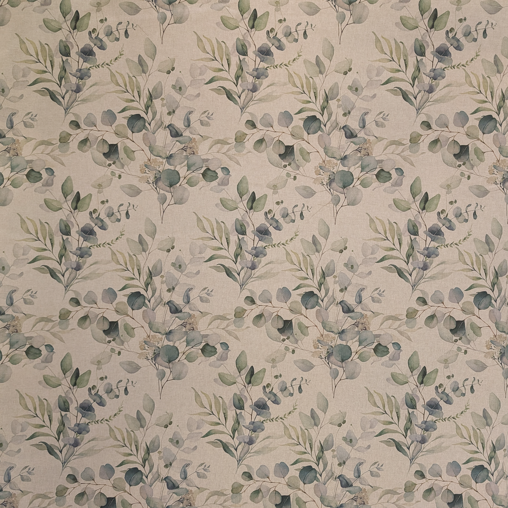 Patterned fabric with green leaves on a beige background