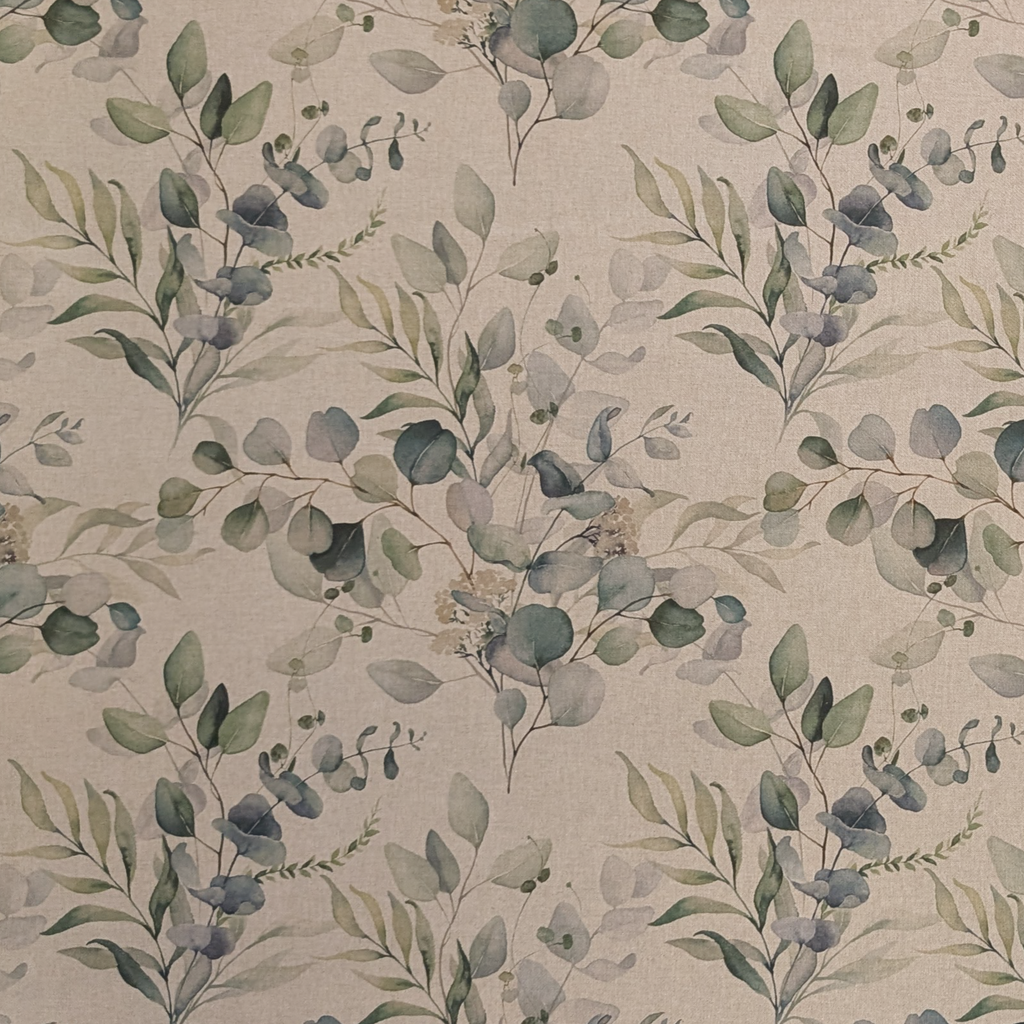 Pattern of green leaves on a beige background