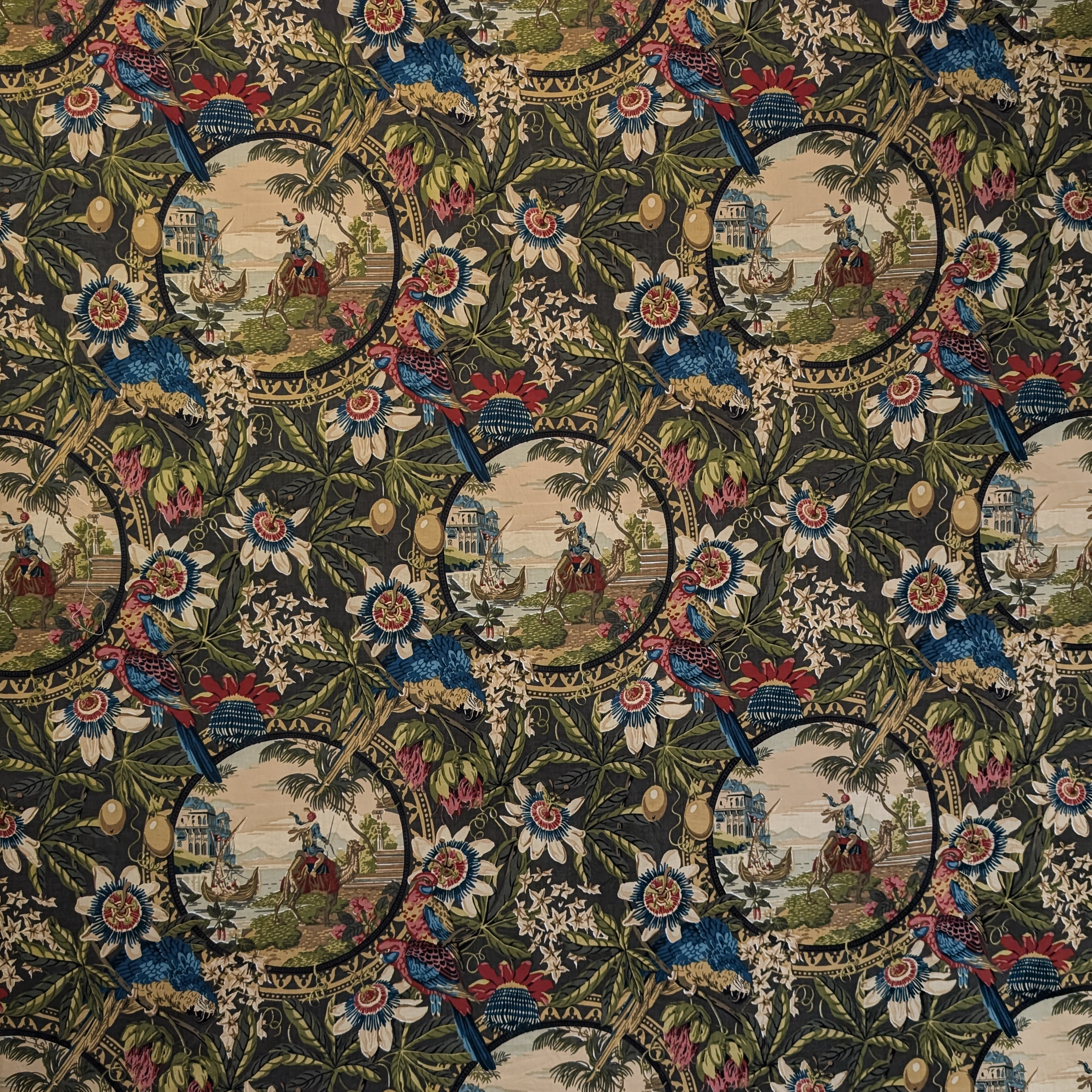 Detailed tapestry with floral patterns and small scenes of people and animals.