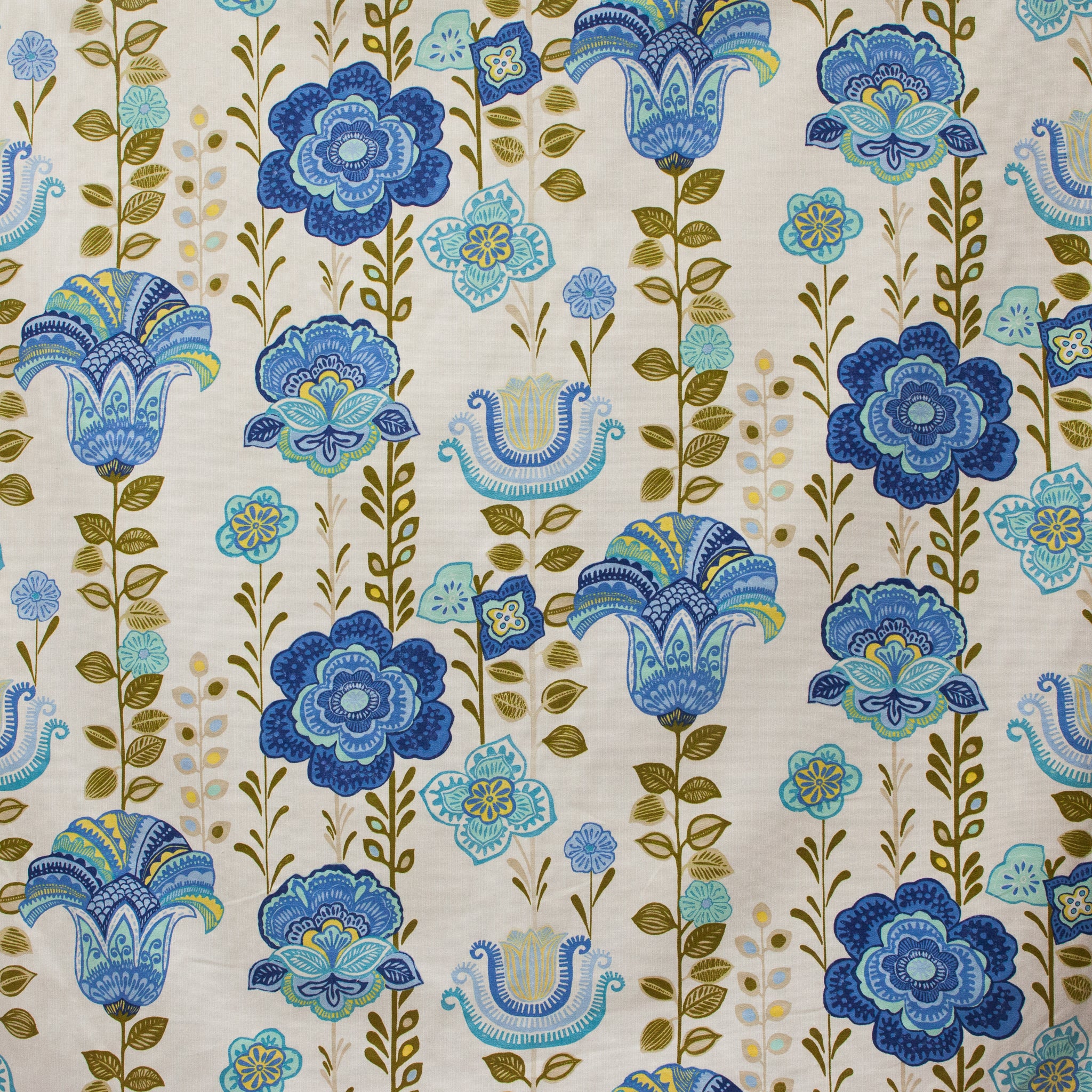 Patterned fabric with blue and green floral design on a beige background