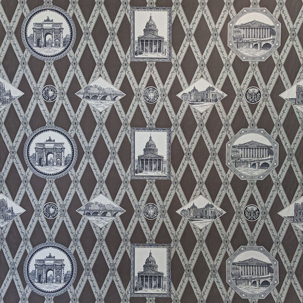 Patterned fabric with architectural designs on a brown background