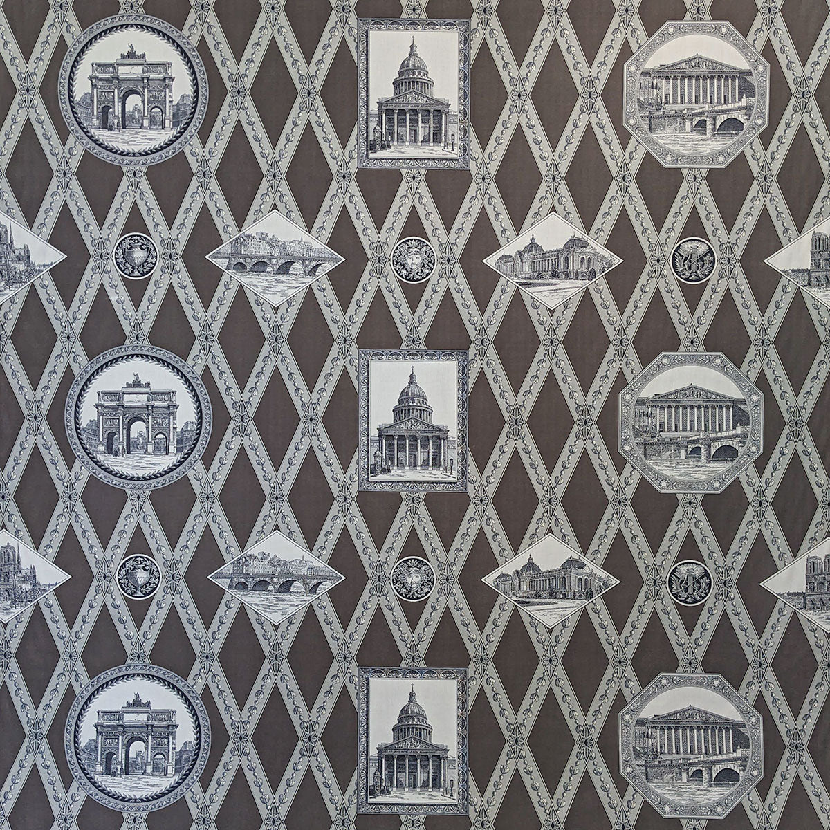Patterned fabric with architectural designs on a brown background