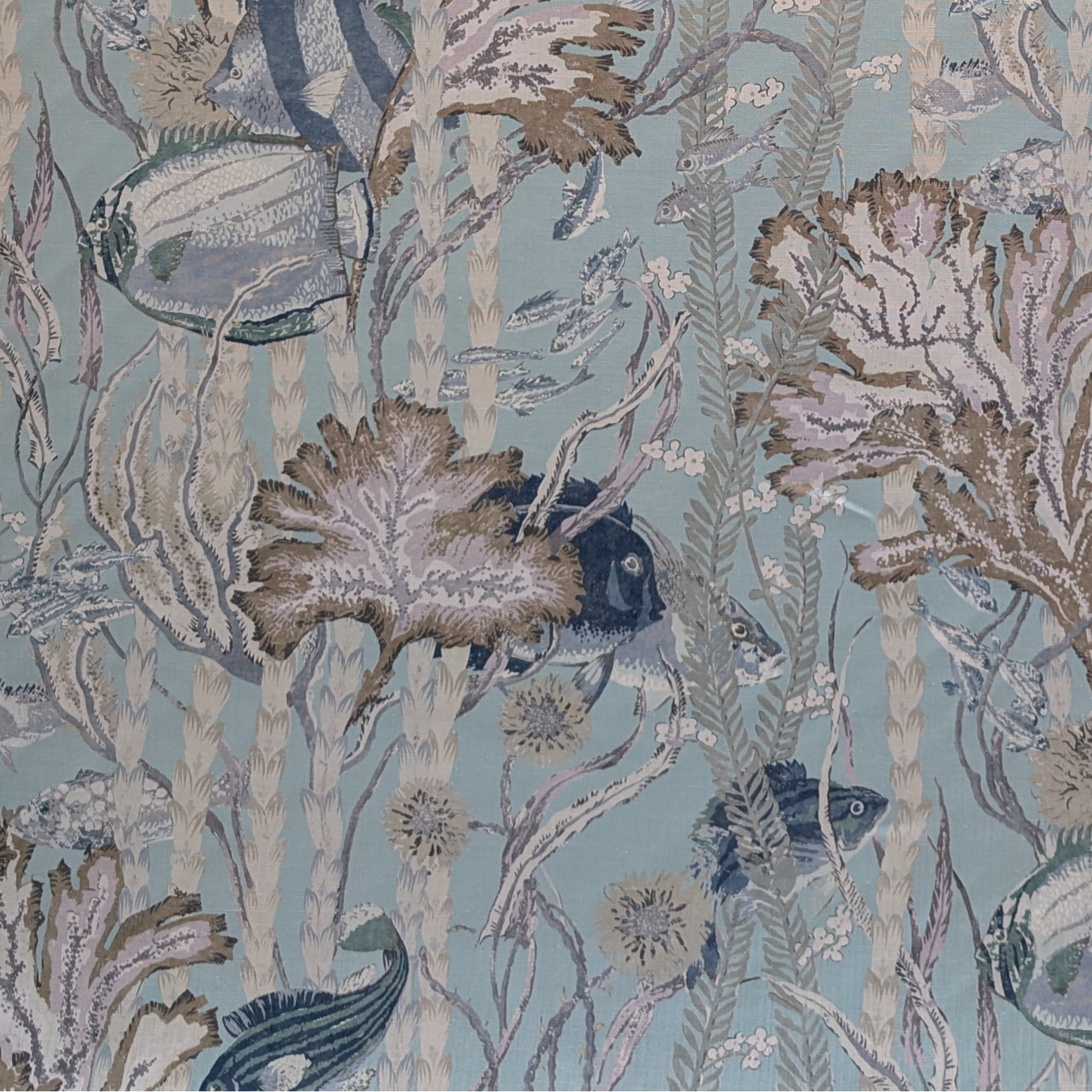 Blue and beige fish and seaweed fabric 