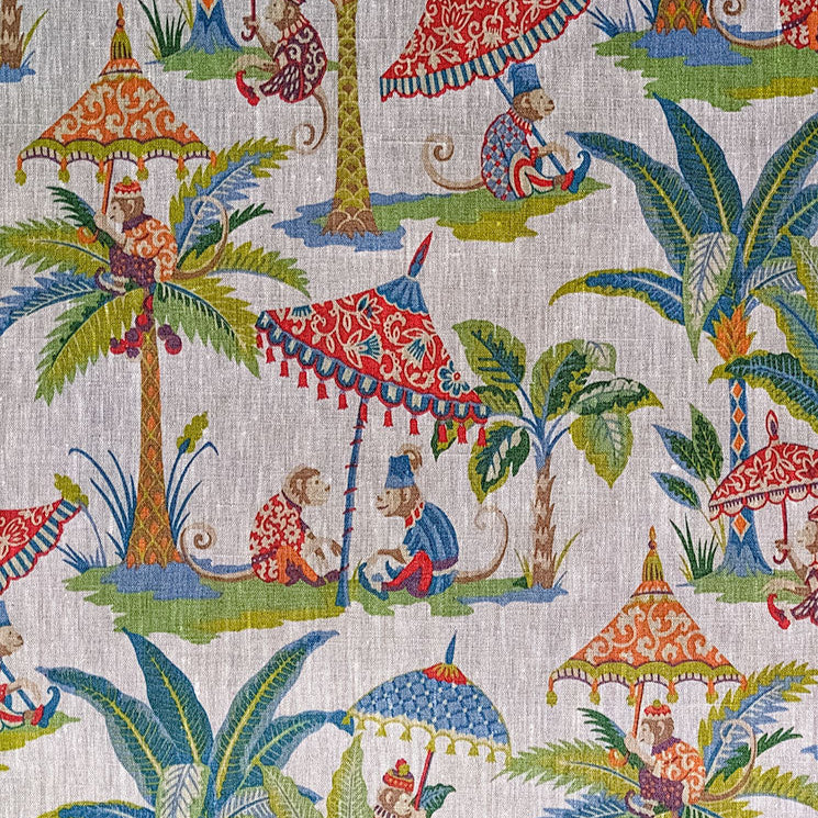 Colorful fabric pattern with palm trees, monkeys, and umbrellas on a beige background