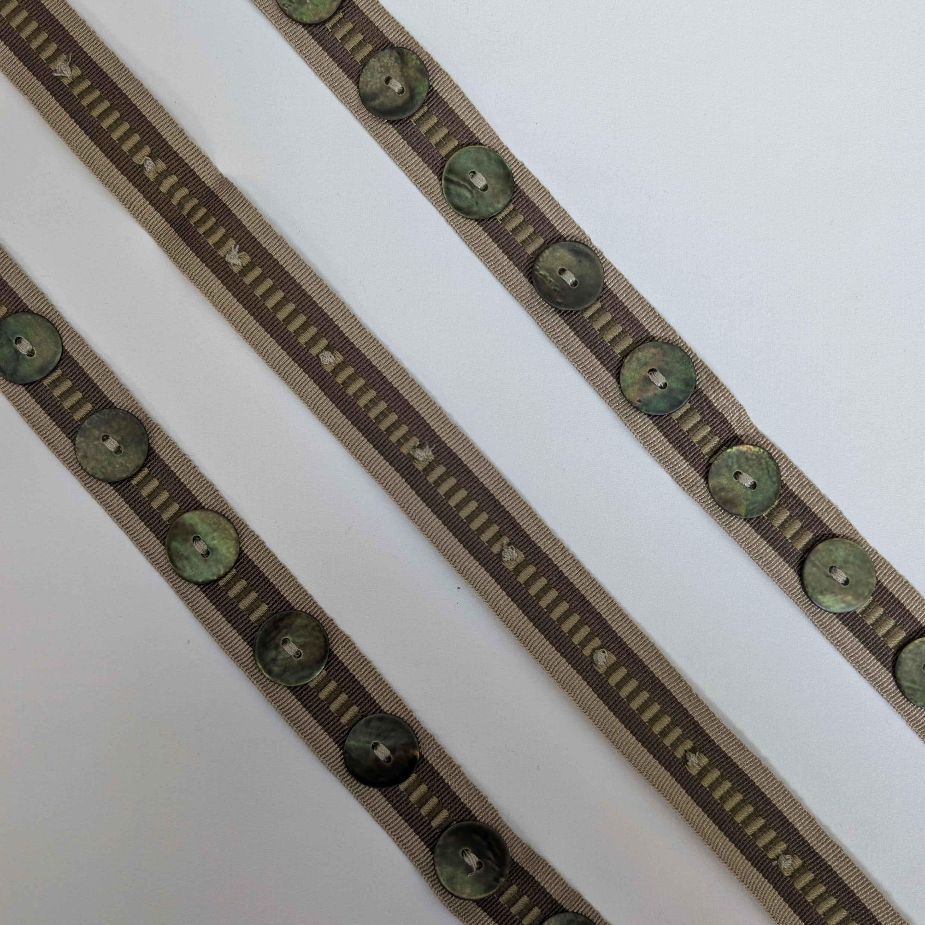 Decorative ribbon with green buttons