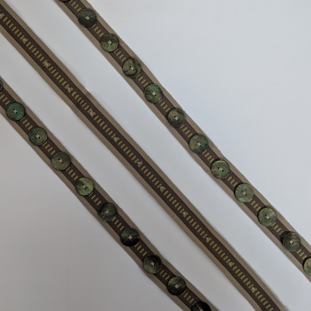 Decorative ribbon with green buttons