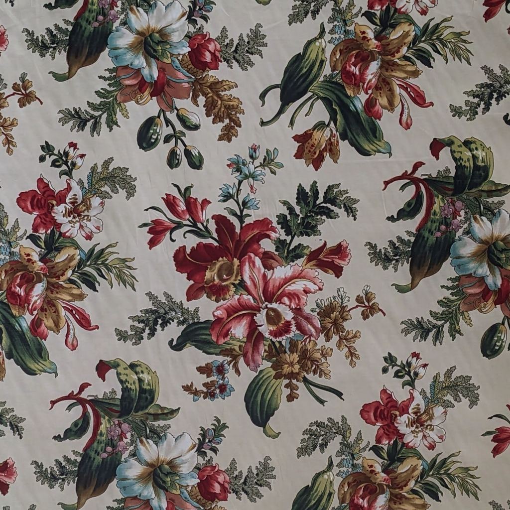 Floral pattern with red, pink, and green flowers on a beige background