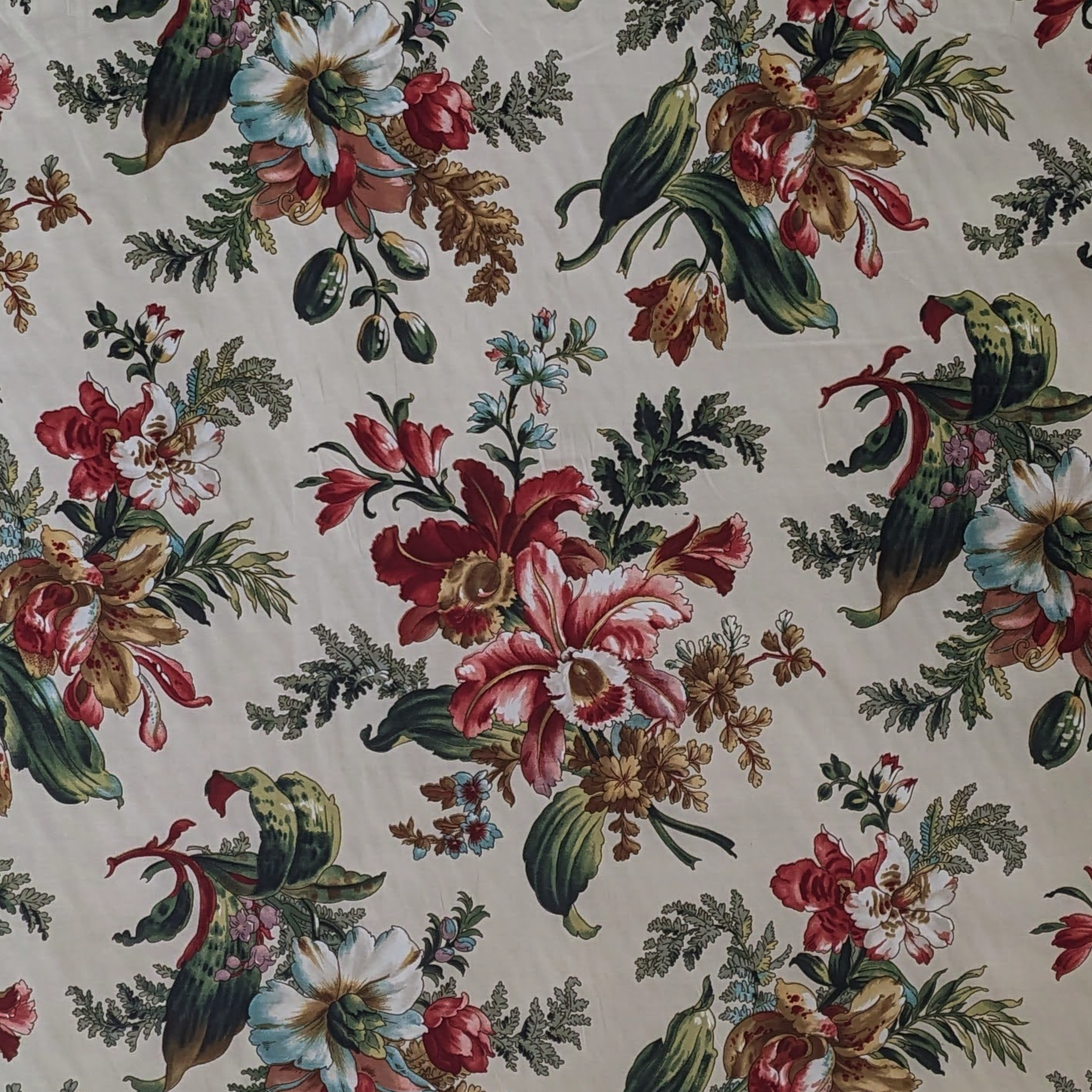 Floral pattern with red, pink, and green flowers on a beige background