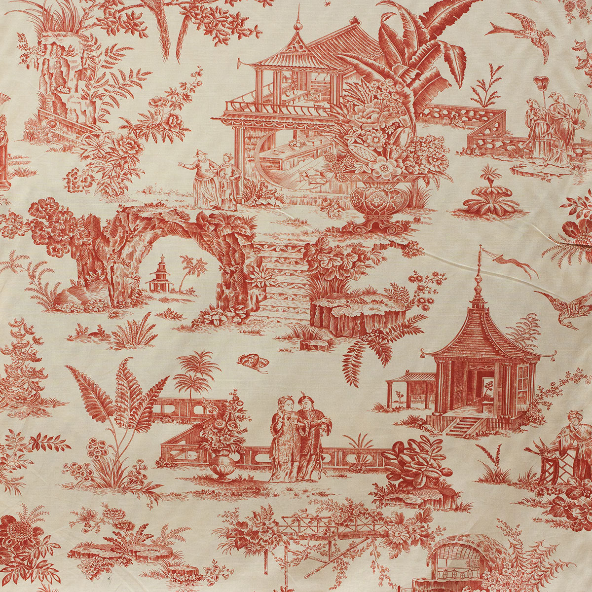 Red and beige toile fabric with garden scene design on fabric