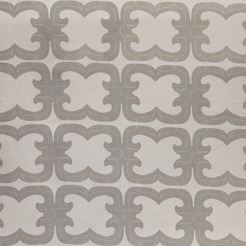 Patterned tile with geometric design on a neutral background