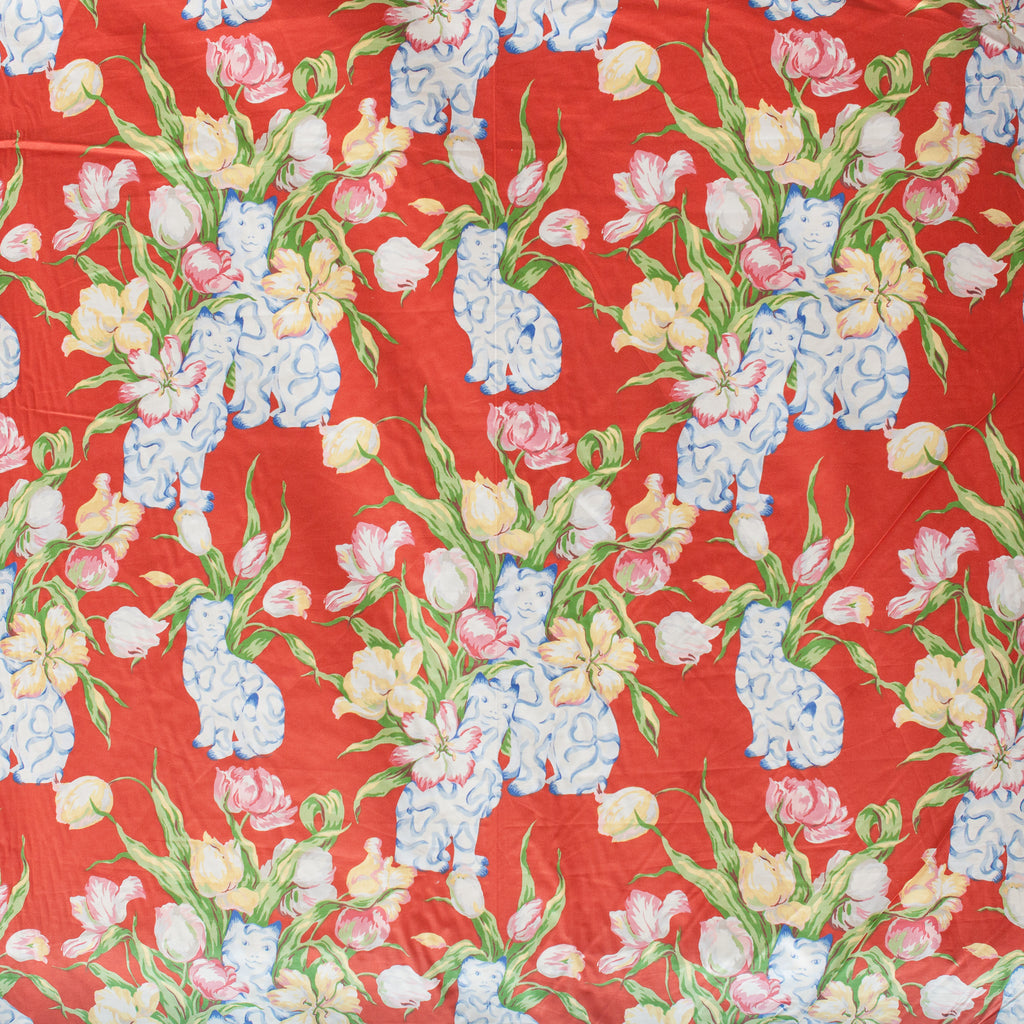 Floral pattern with flowers and cats on a red background