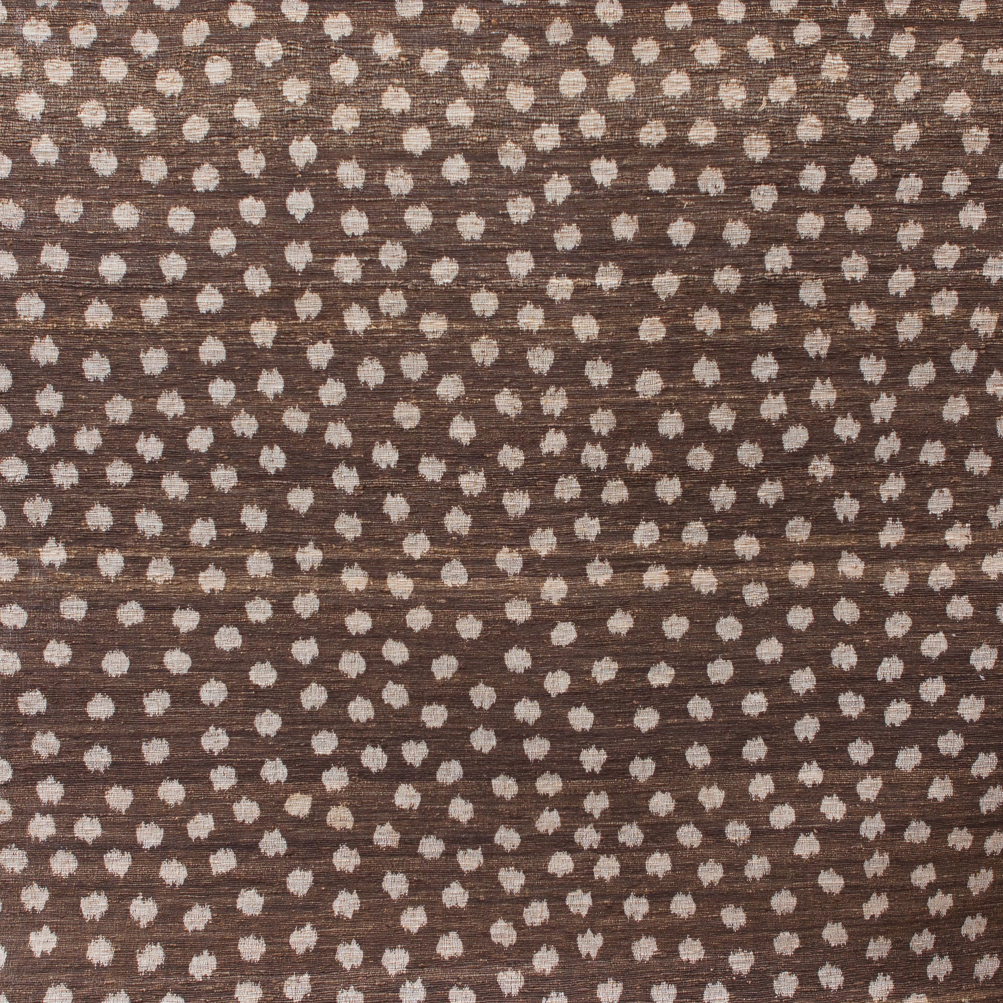 Brown fabric with small white polka dot pattern