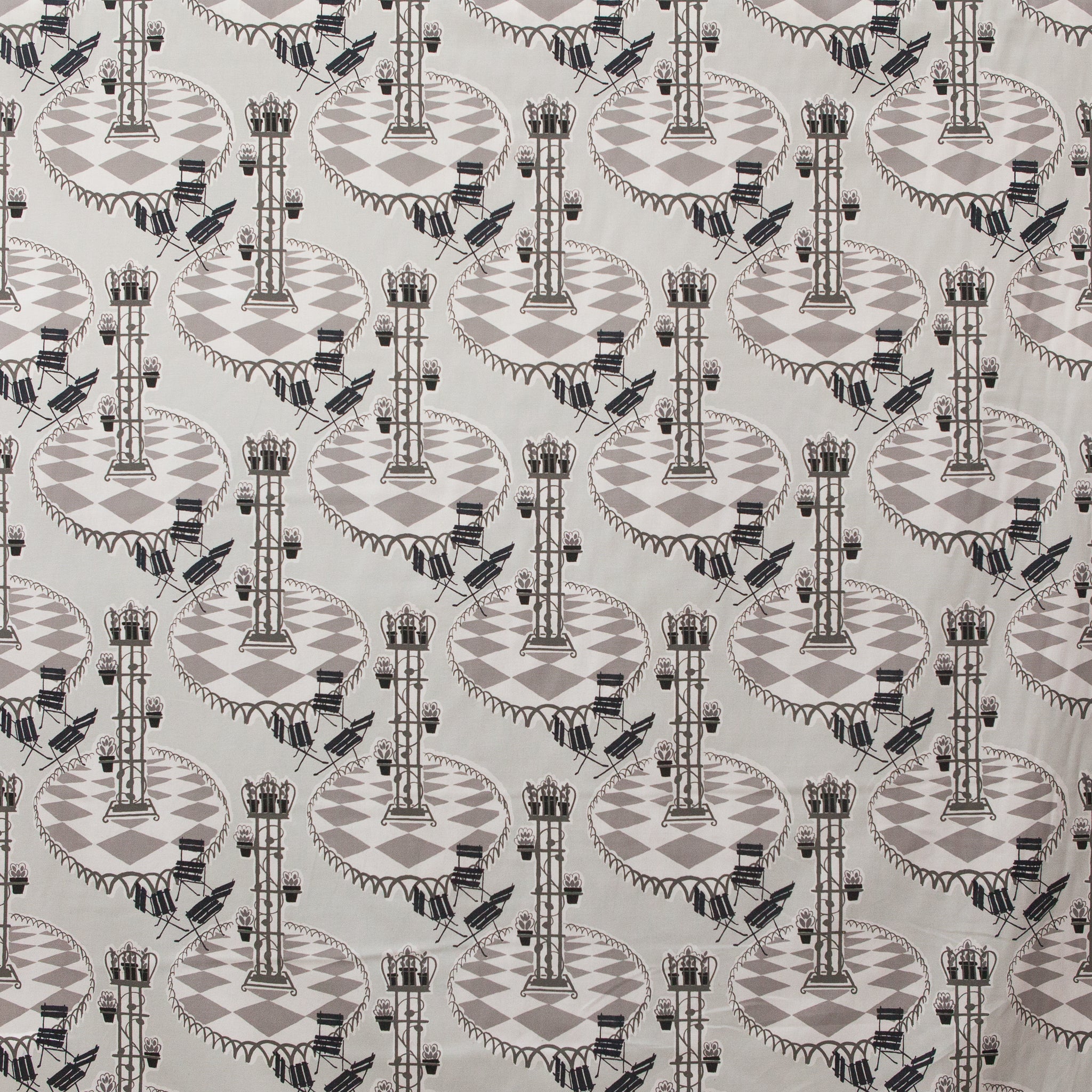 Garden patio scene on fabric in grey and black 