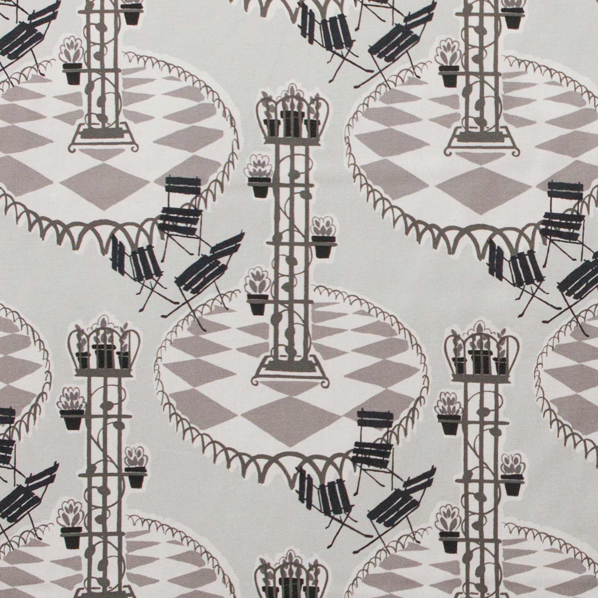 Garden patio scene on fabric in grey and black 
