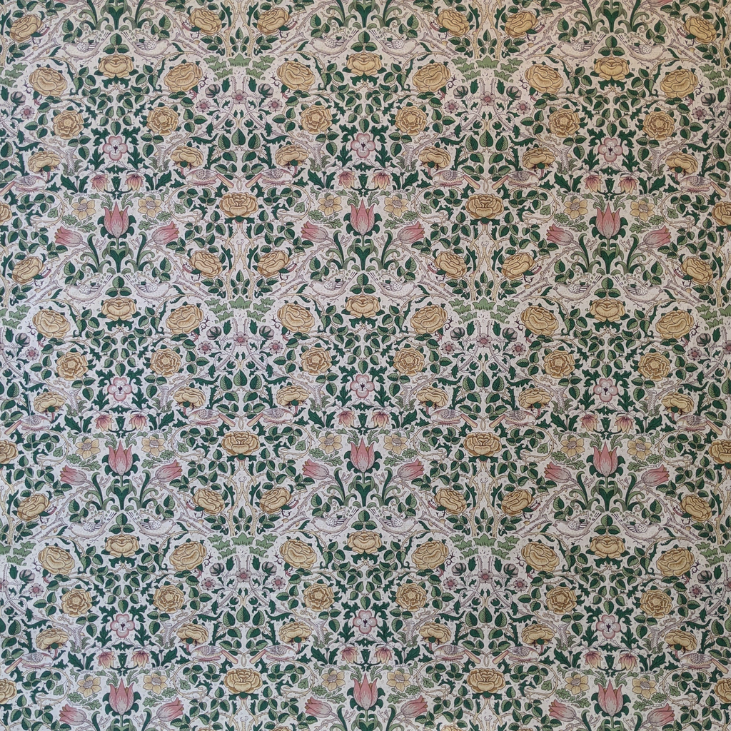 Patterned fabric with floral design on a green background