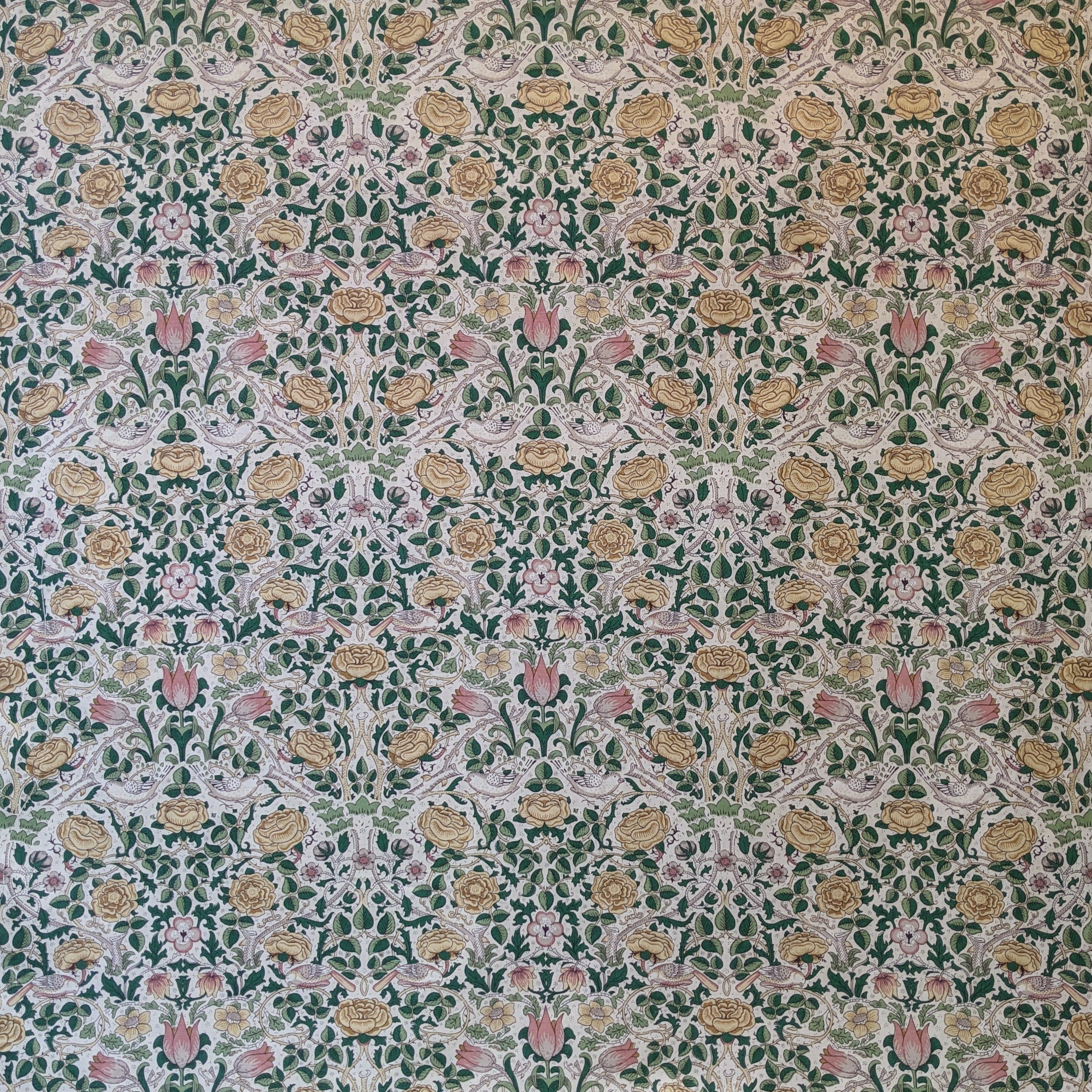 Patterned fabric with floral design on a green background